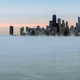 Steam rises over Lake Michigan near the Chicago skyline, Thursday, Jan. 8, 2015. Dangerously cold air has sent temperatures plummeting into the single digits around the U.S., with wind chills driving them even lower. (AP Photo/Teresa Crawford)